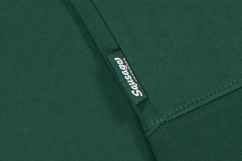 close up of a label on a green hoodie
